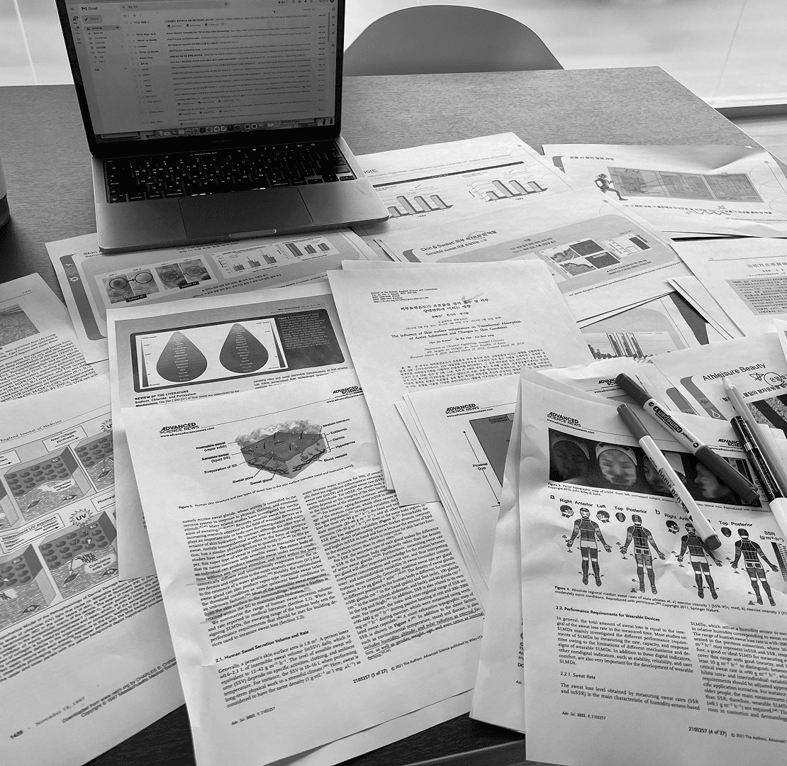 Research papers spread across a desk
